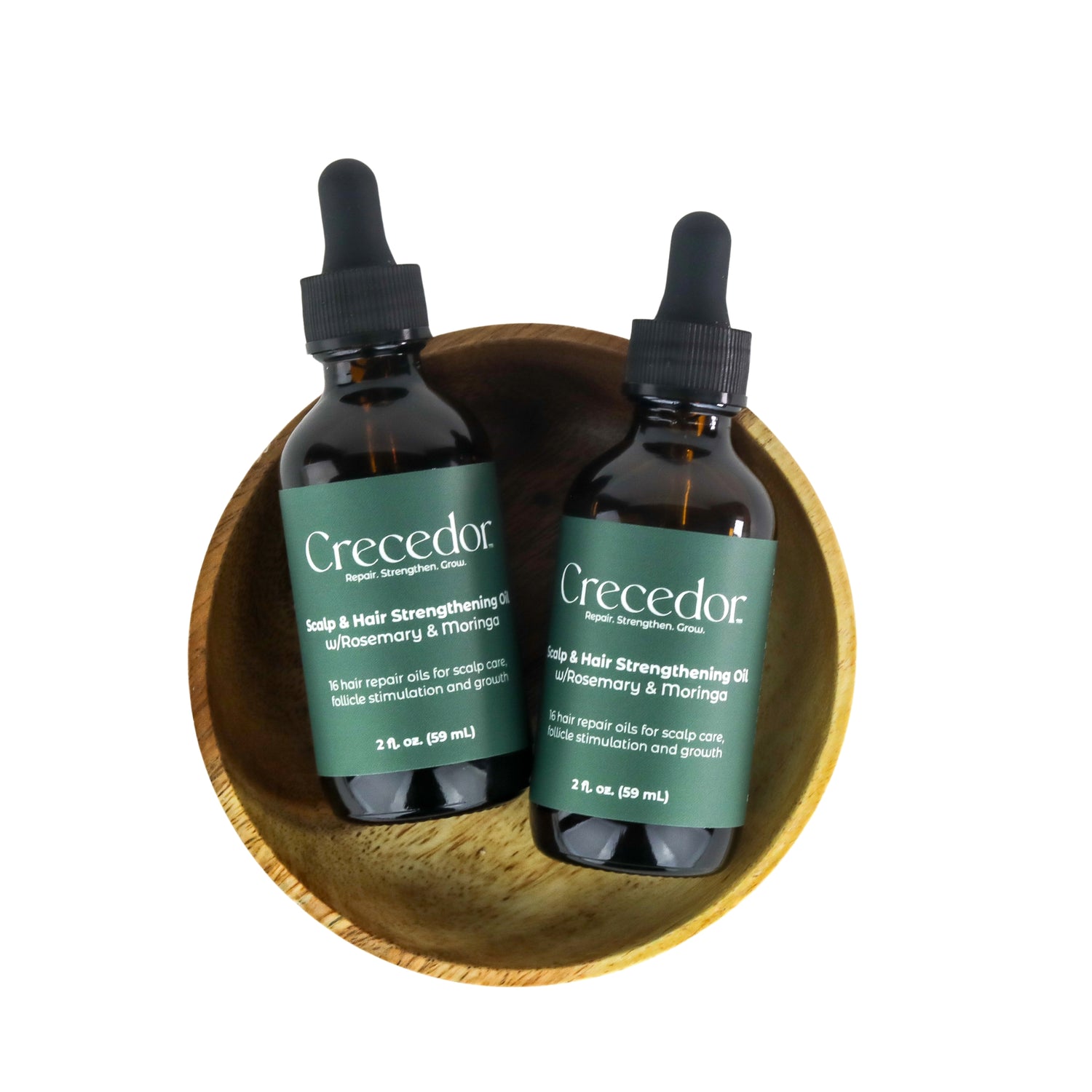Crecedor Scalp & Hair Strengthening Oil with Rosemary & Moringa formulated for thinning, damaged hair. This oil delivers plant-based phytoactives to the scalp and strands, for healthier, stronger, longer hair. Made for all hair types and textures.